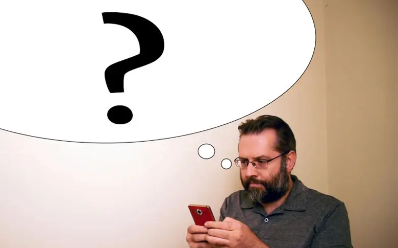 Adam using a phone with a question mark in a thought bubble.