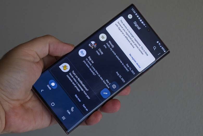 Photo of a smartphone running the Signal app.